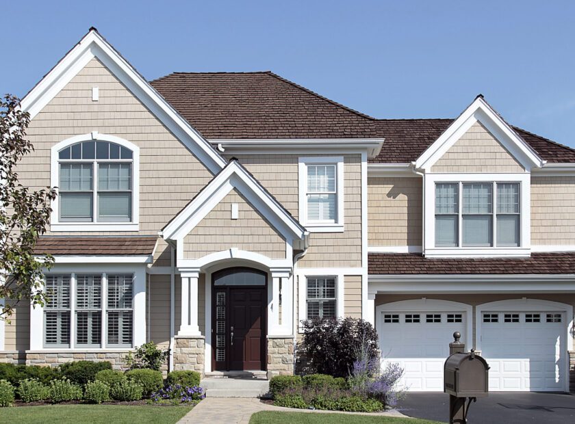 Home with brown cedar roof