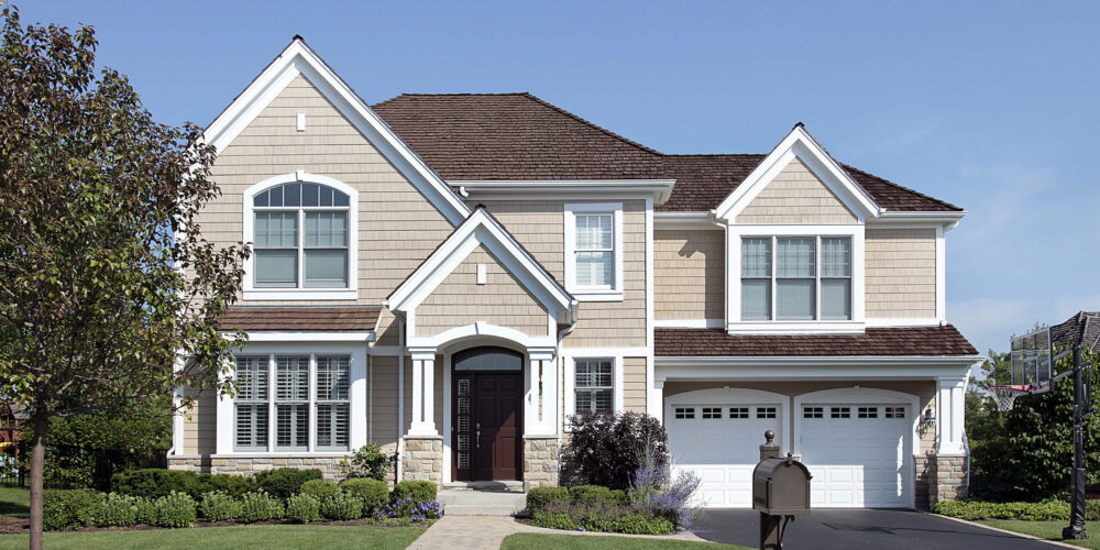 Home with brown cedar roof